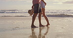 Legs, couple and walking on sand at beach for romantic getaway, summer vacation and tropical adventure. Feet, people and steps with anniversary holiday, travel journey and bonding together at ocean