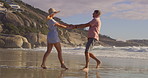 Happy, couple and beach with fun, swing and tropical island with love, care and outdoor date. Spinning, vacation and people together with ocean, sea and summer travel in Bali for anniversary on trip