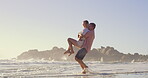 Beach, carry and playing in ocean with couple outdoor together for anniversary, honeymoon or romance. Having fun, joking or smile with man and woman in sea of tropical island paradise for bonding
