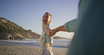 Beach, couple and holding hands with woman laughing and smile from holiday and outdoor date. Sea, travel and fun vacation with joke, journey and love together on anniversary or honeymoon in Bali