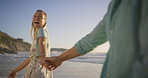 Beach, couple and holding hands with happy woman laugh with smile from holiday and outdoor date. Sea, travel and fun vacation with joke, journey and love together on anniversary or honeymoon in Bali