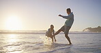 Beach, fun splash and couple for romance, honeymoon and travel for playful, kick and love. Woman, man and sea for date to show partner sunset, adventure or happy bonding and joy on Miami holiday
