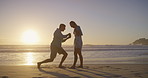 Celebration, hug and proposal with couple on beach together for commitment, love or marriage. Engagement, silhouette or sunset with happy man and woman on sand by ocean or sea to ask the question