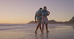 Beach, walking and couple on holiday, hug and bonding in nature, communication and embrace for romance. Love, man and date with woman, travel and peace of ocean, relax and getaway for lovers on trip