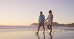 Beach, walking and couple on holiday, holding hands and bonding in nature, talking and romance on date. Love, man and happy with woman, travel and peace of ocean, relax and getaway for lovers