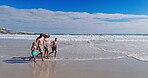 Family, love and holding hands with walking on beach of summer vacation, tropical journey and bonding together. Parents, children and ocean water with holiday peace, calm morning and travel adventure