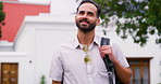 Traveller, man and walking in street, vacation and smile with tourism, urban buildings and Canada. Person, outdoor and guy in road, adventure and journey with happiness, relax and  getaway trip