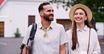 Happy, couple and walking with travel in city for sightseeing view, urban tourism and bonding together. Smile, people and holding hands for vacation, photography and coffee with adventure for getaway