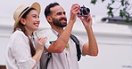 Photographer, couple and camera for vacation, holiday or journey with city, street or town sightseeing. Travel, man and woman with pictures for happy memory, social media and adventure together