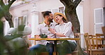Love, smile and camera with couple in cafe for travel vlog, streaming and social media. Laughing, happiness and summer vacation with man and woman in outdoor coffee shop for romance and photography