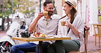 Coffee date, couple and cafe, laughing and joke for bonding at outdoor table for holiday. Man, woman and drink with relax, communication or talk with love, care and restaurant conversation for travel