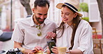 Love, smile and phone with couple in cafe for restaurant review, streaming and social media. Website, happiness and summer vacation with man and woman in outdoor coffee shop for romance and food blog