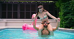 Laughing, pool party and couple with fun, splash and bonding at hotel or resort. Swimming, shoulder carry and man with woman, water and balance for summer event, holiday celebration or adventure