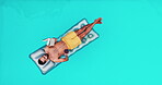 Cocktail, inflatable and relax with man in swimming pool from above for reading on holiday or vacation. Book, summer and wellness with person on water with mockup space for break or leisure at resort