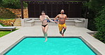 Swimming, couple and jumping in pool on holiday for travel adventure, recreation and bonding together at resort. Drone view, people and holding hands with water splash for fun at vacation destination