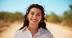 Face, happy and woman with travel in nature for safari adventure, confident journey and holiday destination. Tourist, person and smile in desert road for vacation getaway, weekend break and exploring