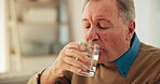 Senior man, tremors and drink water for hydration, slow movement and symptoms of parkinsons disease. Elderly person, thirsty and refreshing beverage for wellness, nutrition  diet and disorder at home