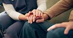 Holding hands, senior patient and caregiver with support for wellness, trust and empathy for illness. Closeup, old person and nurse with kindness, elderly care and console on sofa in retirement home
