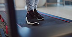 Shoes, person and walking on treadmill for exercise, physiotherapy and rehabilitation. Legs, cardio machine and training for fitness, healthcare or wellness with physical therapy for recovery in home