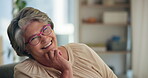 Face, laughing and relax with old woman on sofa in living room of retirement home for humor. Comedy, happy and silly with funny senior person in apartment for break, pension or weekend wellness
