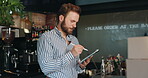 Cafe, entrepreneur and man with tablet, online order and checklist for stock with stylus or ecommerce. Coffee shop, inventory and preparing for delivery with tech, small business or person with boxes