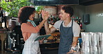 Barista, woman and man with high five at cafe, tablet or celebration for profit, sales or results. People, waiter and partnership at small business, cheers or goals for target with app at coffee shop