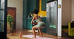 Fitness, woman and squat in home for exercise, core strengthening and leg muscle development on yoga mat. Back, girl and workout in kitchen for healthy body, toning glutes and training for wellness