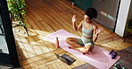 Yoga, live streaming and woman with laptop in home for workout videos, online tutorial and lesson. Influencer, trainer and person on computer wave for fitness, exercise and pilates subscription