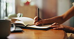 Writing, notebook and hands with pen for diary entry, notes and creative ideas on desk. Thinking, book and closeup of person for planning, schedule and agenda or to do list, calendar and journal