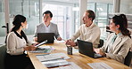 Collaboration, meeting and workshop with business people in boardroom of office together for strategy. Documents, laptop and tablet with employee group in workplace for planning, seminar or training