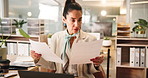 Serious, employee and woman with documents, office and brand manager with info and marketing strategy. Business, reading and person with laptop for project, research and writing industry trends