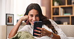 Happy, relax and woman with smartphone, home and reading  ebook on website, online and living room. Chilling, reader and person with mobile for entertainment, smile or tech for digital novel in house