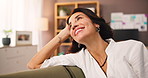 Thinking, happy and woman on sofa in home with memory, reflection or reminiscing with positive news. Smile, relax and female person in living room for remember, choice or decision in apartment.