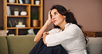 Stress, thinking and sad woman in home for decision, reflection and bored on sofa. Mental health, unhappy or lonely person with depression in living room, doubt or remember serious memory with regret