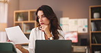 Thinking, paperwork and business woman in home with laptop for solution, planning and finance decision. Remote work, professional and person on computer with documents for report, review and research