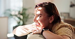 Girl, smile and thinking of memory on sofa with nostalgia, mindfulness and perspective in home. Peaceful, woman and reflection in lounge with weekend break, sunlight and planning decision with relax