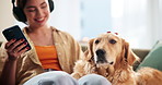 Home, dog and woman with mobile for headphones, podcast and bonding with domestic pet on sofa. House, animal and golden retriever with female person for relax, listening music and mobile for sound