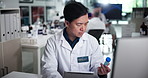 Tablet, medical research and man with test tube, lab and typing results of experiment and computer. Healthcare, scientist and inspection of sample for breakthrough, analysis or person with technology