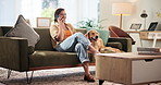 Home, dog and woman with phone call for communication, laugh and bonding with domestic pet on sofa. House, animal and golden retriever with female person for mobile, conversation or chat with contact