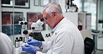 Scientist, man and label on sample in laboratory for cure development, medical innovation and clinical analysis. Science, mature person and sticker on test bottle for pharmaceutical drug and research