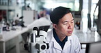 Scientist, man and microscope with laptop, research and review process for results in pharmaceutical study. Person, insight and clinical trial for medicine, computer and stats report at laboratory