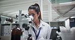 Scientist, woman and microscope at lab with computer, test and review with results in pharmaceutical research. Person, smile and clinical trial with medicine, perspective and solution by laptop