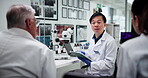 Collaboration, scientist and group with tablet, lab and discussion for medical research and treatment. Pharmaceutical, teamwork and people with tech for healthcare, info and ideas for breakthrough