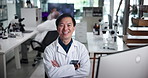 Happy, crossed arms and face of scientist in laboratory for pharmaceutical research, study or project. Confident, smile and portrait of Asian medical biologist with pride for healthcare innovation.