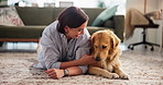 Relax, smile and woman with dog in living room in home for bonding, connection or companion on carpet. Love, adoption and female person on floor with golden retriever pet for rubbing animal or puppy.