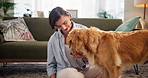 Home, woman and feed dog with treats for animal wellness, training reward or domestic companion. Nutrition, owner and golden retriever in floor with bonding, food and snacks for loyalty or protection