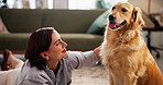 Relax, connection and woman with dog in living room in home for bonding, love or companion. Happy, adoption and female person on floor with golden retriever pet for rubbing animal, pet or puppy.