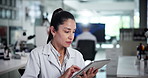 Scientist, woman and tablet in laboratory for research, problem solving or thinking of development. Medical, science and doctor with technology for pharma, insight and scroll peer review journal
