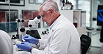 Scientist, man and label on medicine in laboratory for drugs research, production and development. Medical, science and mature doctor with bottle for pharma, healthcare innovation and sticker on cure