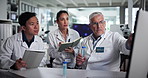 Computer, tablet and test tube with scientist people in laboratory for collaboration or discussion. Healthcare, medical analysis and research with group at work on science breakthrough for innovation